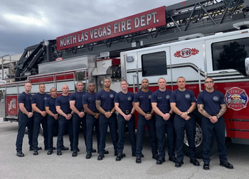 NLVFD academy graduates pose in front of a fire truck